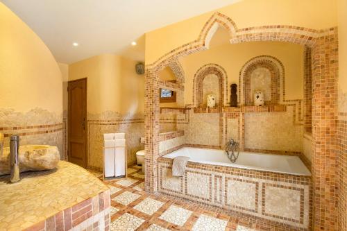 a bathroom with a large tub in a room at Casa Anakena in Guía de Isora