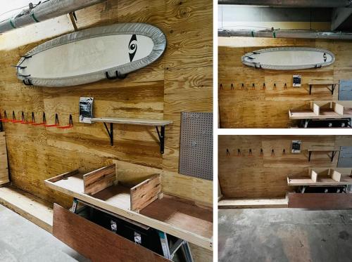 a room with a surfboard on a wooden wall at Tabist Diversity Hotel Sin Tokiwa Asahikawa in Asahikawa