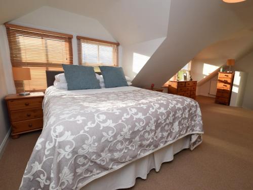 a bedroom with a large bed in a attic at 1 Bed in Morebattle 52538 in Morebattle