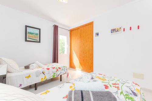 Postel nebo postele na pokoji v ubytování Casa El Cipres