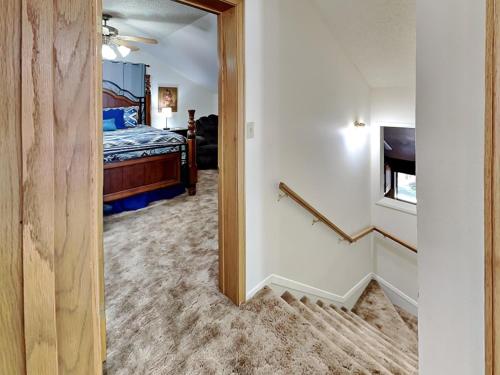 a hallway leading to a bedroom with a bed at Quiet Mountain Hideaway in Alto