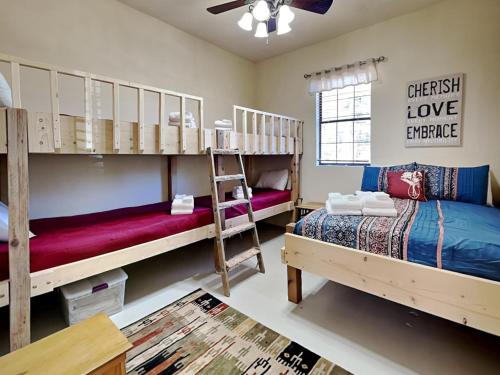 a bedroom with two bunk beds and a couch at Quiet Mountain Hideaway in Alto