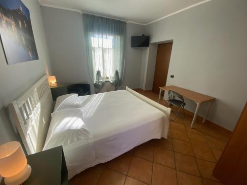 Letto o letti in una camera di DOMUS Hotel