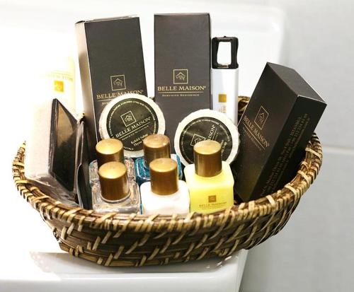 a basket filled with perfume and other products on a table at Belle Maison Hotel&Residence in Istanbul