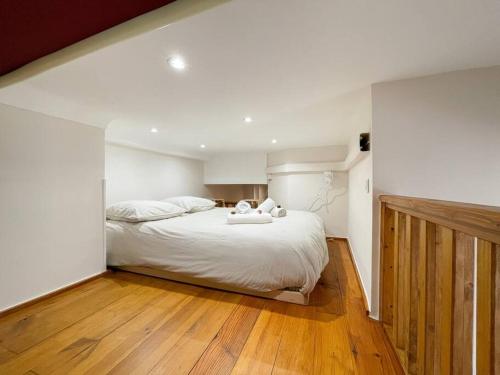Ένα ή περισσότερα κρεβάτια σε δωμάτιο στο Le calmette
