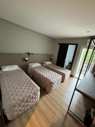 Postel nebo postele na pokoji v ubytování Arco do Sol Park Hotel