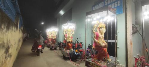 a group of motorcycles parked in front of a building at Anand Inn in Bodh Gaya