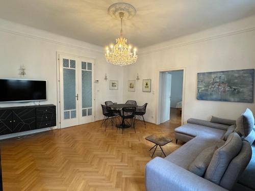 a living room with a couch and a table at Atelier Lomani in Vienna