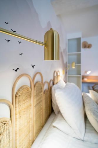 a bedroom with wicker beds and birds on the wall at Apartament Widokowe Polany by Apart Concept Podhale in Kościelisko