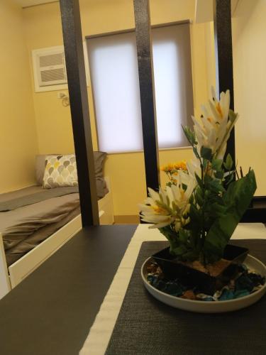 C516 Place at SMDC Cheer Residences by Lee Portumにあるベッド