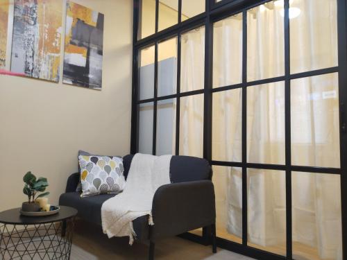 C516 Place at SMDC Cheer Residences by Lee Portumにあるベッド