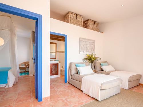 a living room with a couch and a table at Blue Home in Sitges