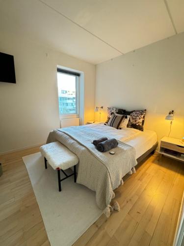 a bedroom with a large bed and a window at Cute Pug Guest Room in Copenhagen