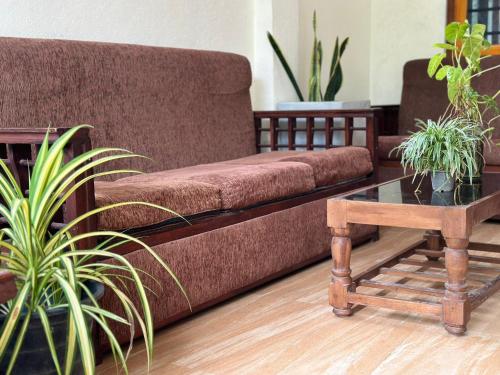a living room with a couch and a coffee table at lake paradise in Habaraduwa