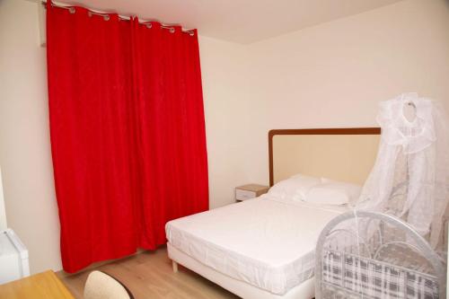 Ένα ή περισσότερα κρεβάτια σε δωμάτιο στο Hotel le Privilege