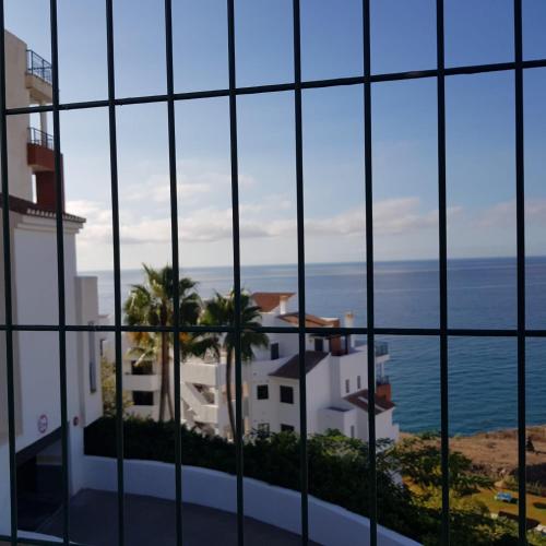 a view of the ocean from a building at Apartamento frente al mar con parking privado in Torrox
