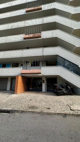 a building with a motorcycle parked in front of it at airport room in Lisbon
