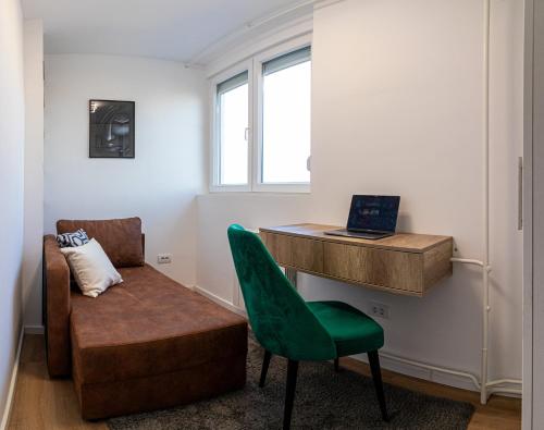 a room with a desk and a chair and a table at Sunny Nest Apartment in Fontana
