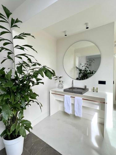 a bathroom with a sink and a mirror at Casabell 3 - Caminito del Rey in Valle de Abdalagís