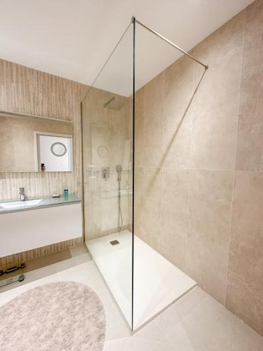 a bathroom with a shower and a sink at Villa Isobel in Vila Verde