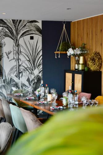 a table with glasses and bottles on it in a room at Bedford Hotel Brussels in Brussels