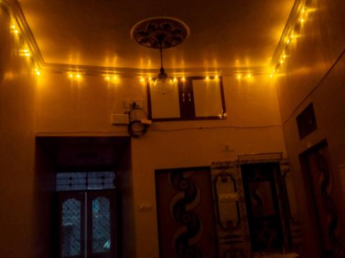 a room with lights on the wall and a ceiling at AB guest house { home stay} in Bikaner