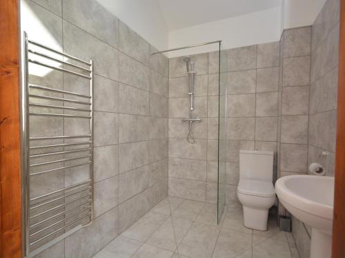a bathroom with a shower and a toilet and a sink at 2 bed property in Bath 72837 in Chew Magna