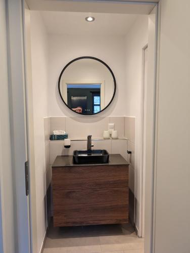 a bathroom with a sink and a mirror at Burghaus-Cochem in Cochem
