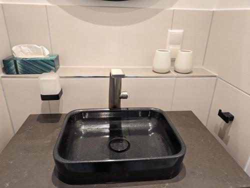 a kitchen sink with two candles on a counter at Burghaus-Cochem in Cochem