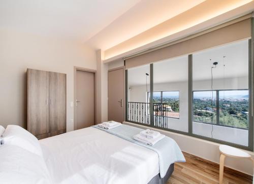 Katil atau katil-katil dalam bilik di Elthea Villas
