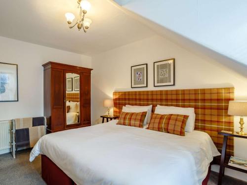 a bedroom with a large bed and two lamps at 2 bed in Inverness CA328 in Inverness