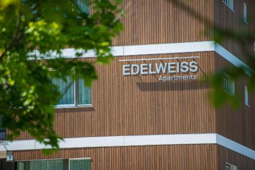 a sign on the side of a building at Apartment Edelweiss in Brunico