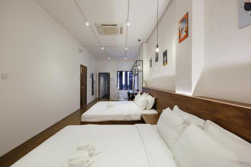 Llit o llits en una habitació de Kangsar Inn 73