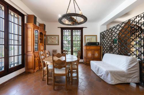 a living room with a table and a white couch at Almarchada 38 in Mijas