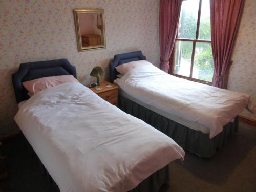 Postel nebo postele na pokoji v ubytování Canary Cottage