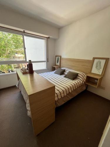 En eller flere senge i et værelse på Departamento Zona Centro, Bosque y facultades