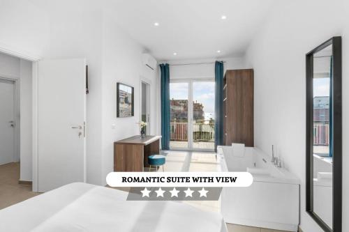 a white bathroom with a tub and a sink at Pangea Rooms in Castellammare di Stabia