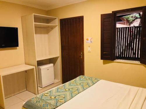 Postel nebo postele na pokoji v ubytování Hotel Pousada Latitude