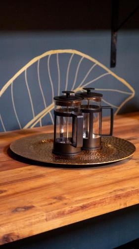 a candle holder sitting on top of a table at Casa Mosaiko Patio Bonito in Medellín