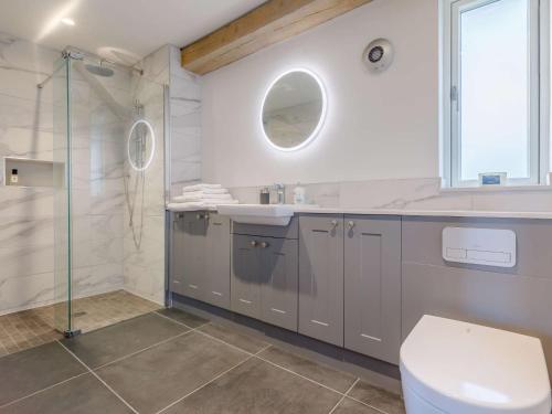 a bathroom with a toilet and a sink and a shower at 1 bed in Taunton 86623 in Broomfield