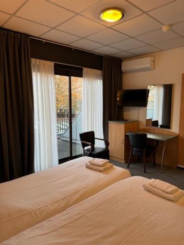 Ένα ή περισσότερα κρεβάτια σε δωμάτιο στο Hotel Schimmel