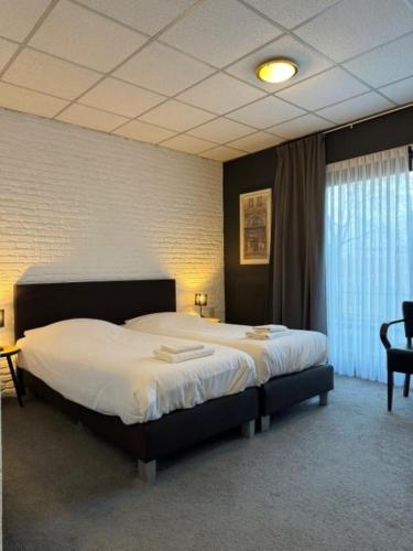 Ένα ή περισσότερα κρεβάτια σε δωμάτιο στο Hotel Schimmel