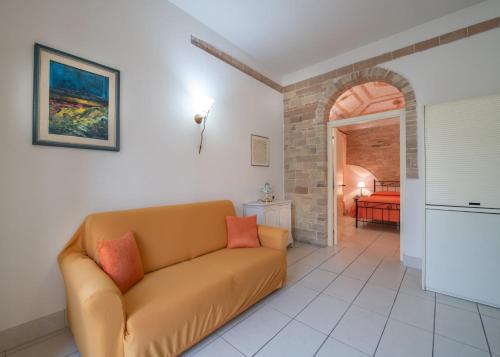 a living room with a couch and a bedroom at Le dimore Al Vecchio Teatro in Ortona