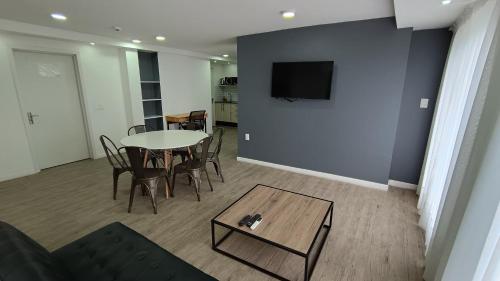 TV a/nebo společenská místnost v ubytování Quijano Hotel - Aparts & Suites