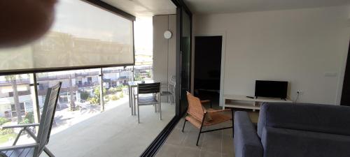 TV a/nebo společenská místnost v ubytování OD'A Apartaments