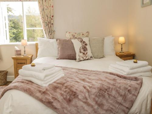 a bedroom with a bed with towels on it at 31 Riverside in Bridgnorth