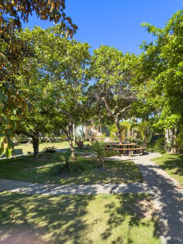 a park with a picnic table and trees at Rancho Litoral Búzios in Búzios