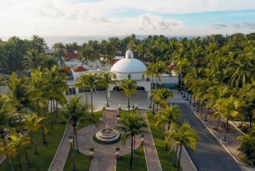 an aerial view of the grounds of a resort with palm trees at El Dorado Seaside Palms, Catamarán, Ecoturistic Ranch, All & More Inclusive - Adults Only in Akumal