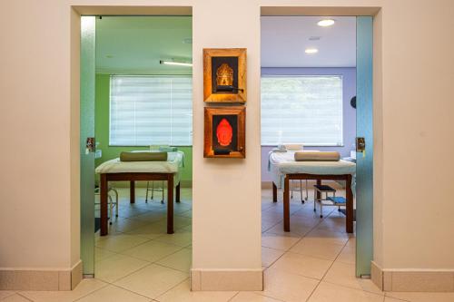 a room with a table and chairs in it at Panorama Hotel in Águas de Lindóia