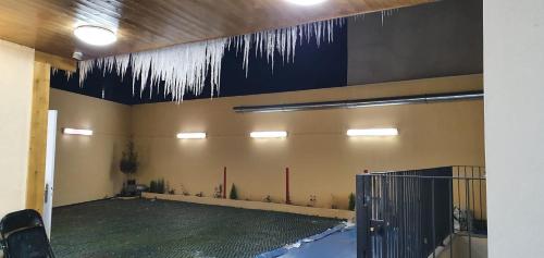 a room with icicles hanging from the ceiling at Hotel le Privilege in La Courneuve